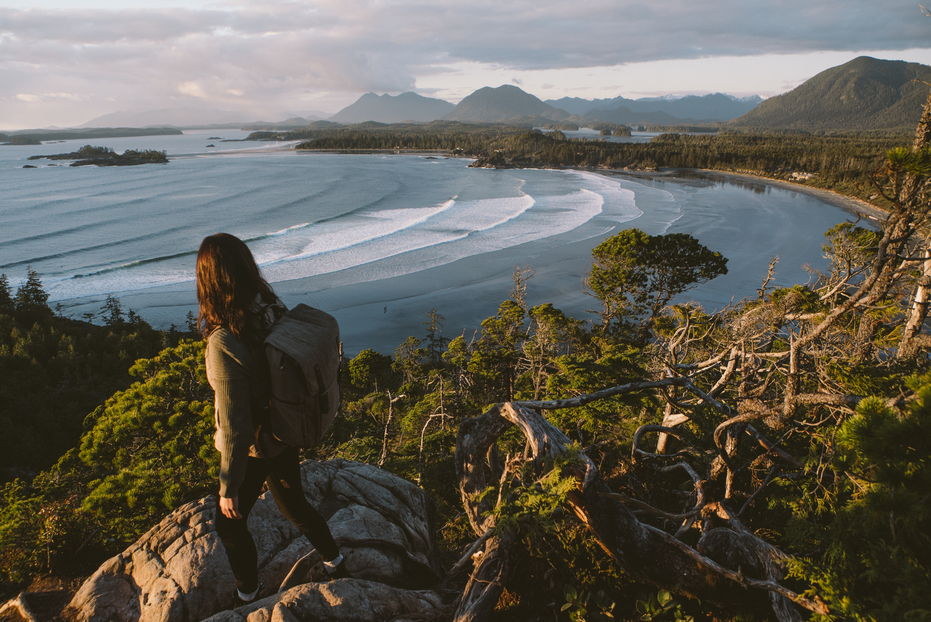 A women looks out at the Cox Bay lookout in Tofino